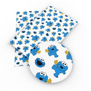 Cookie Monster Litchi Printed Faux Leather Sheet Litchi has a pebble like feel with bright colors