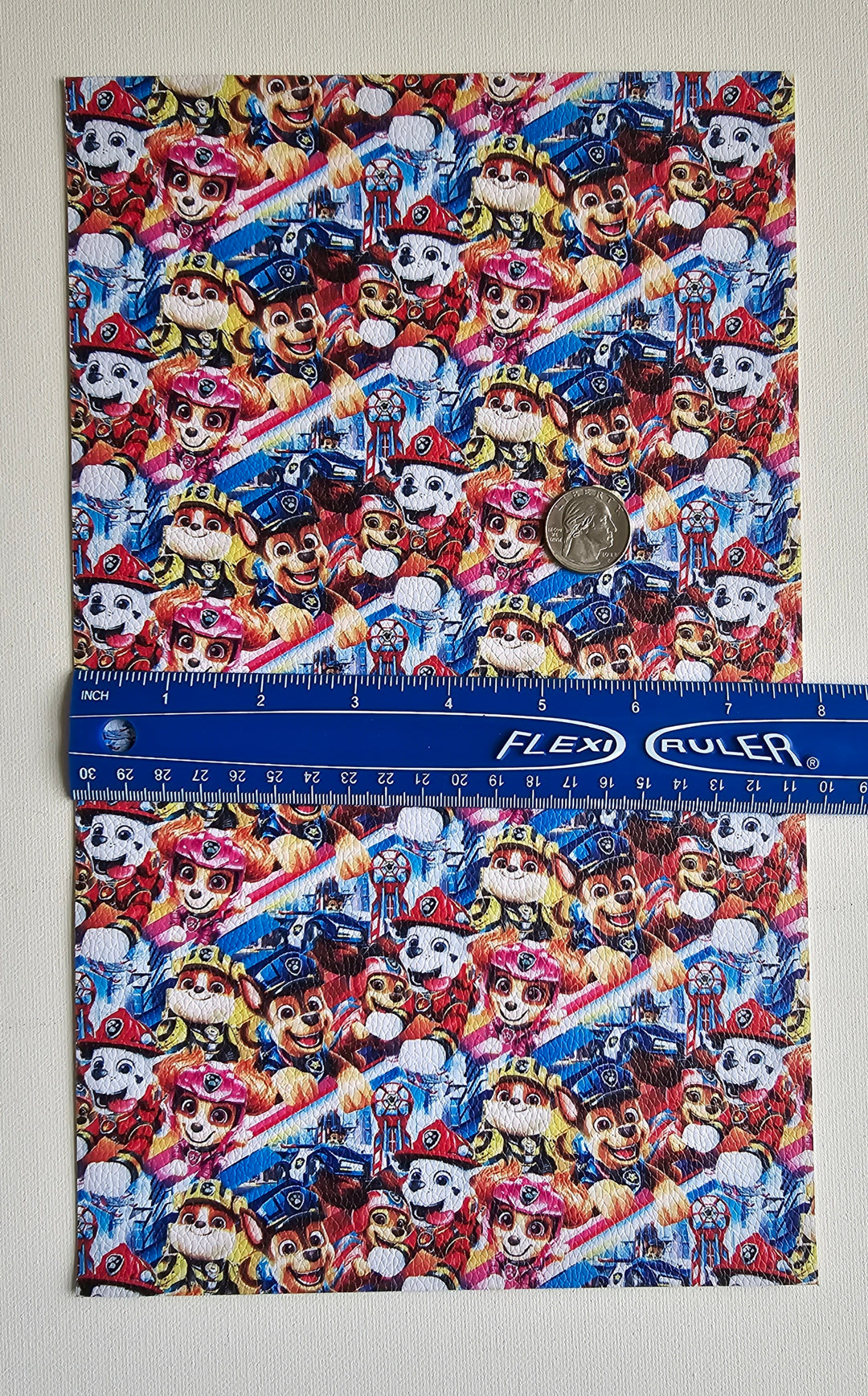 Paw Patrol Litchi Printed Faux Leather Sheet Litchi has a pebble like feel with bright colors