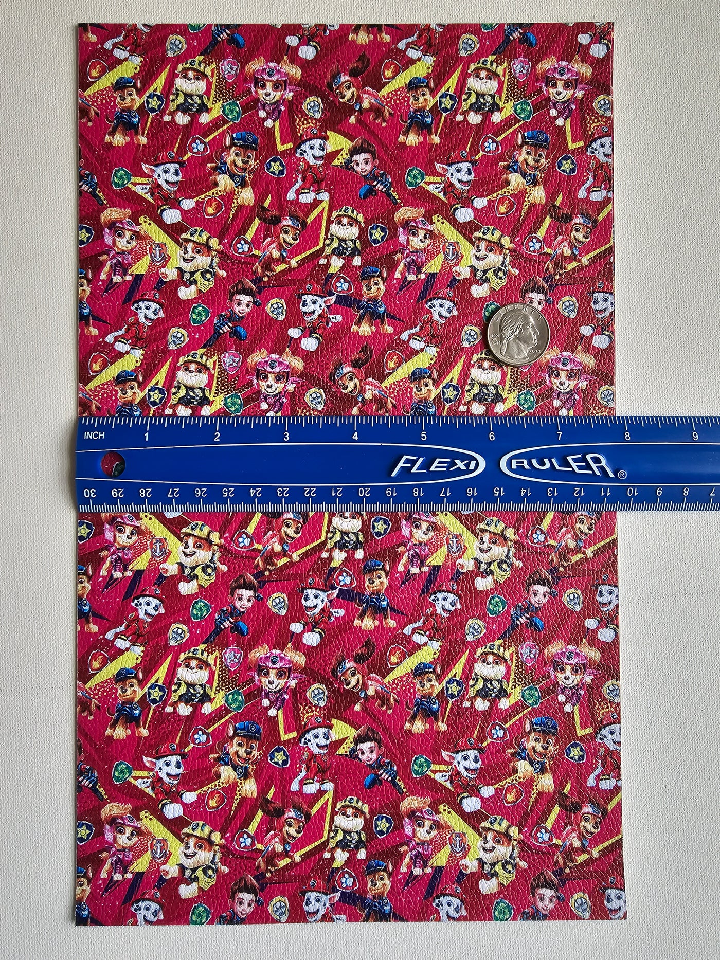 Paw Patrol Litchi Printed Faux Leather Sheet Litchi has a pebble like feel with bright colors