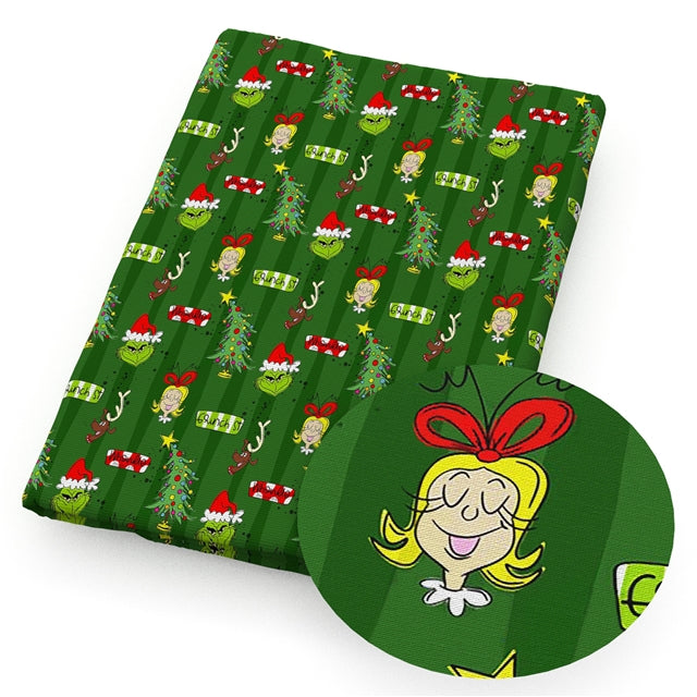 The Grinch and Cindy Litchi Printed Faux Leather Sheet Litchi has a pebble like feel with bright colors