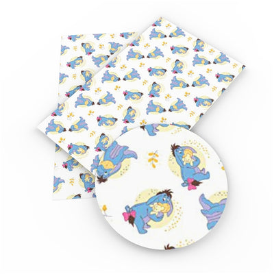 Eeyore Blue Donkey Litchi Printed Faux Leather Sheet Litchi has a pebble like feel with bright colors