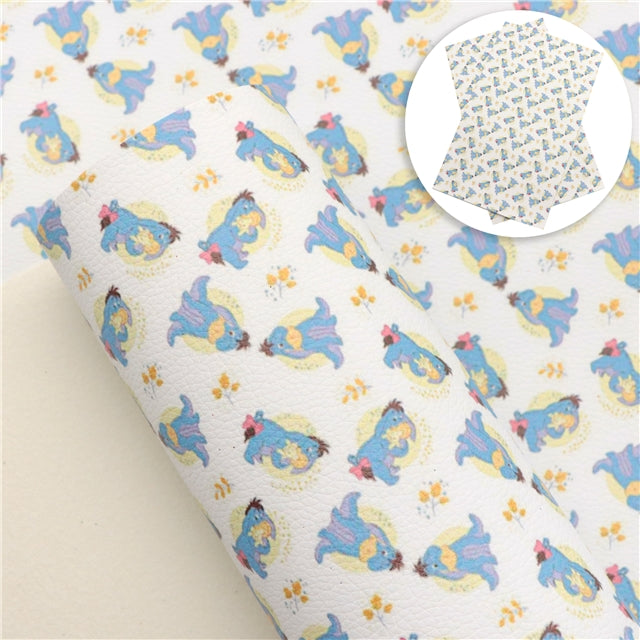 Eeyore Blue Donkey Litchi Printed Faux Leather Sheet Litchi has a pebble like feel with bright colors