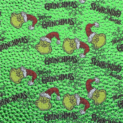 The Grinch Holographic Litchi Printed Faux Leather Sheet Litchi has a pebble like feel with bright colors